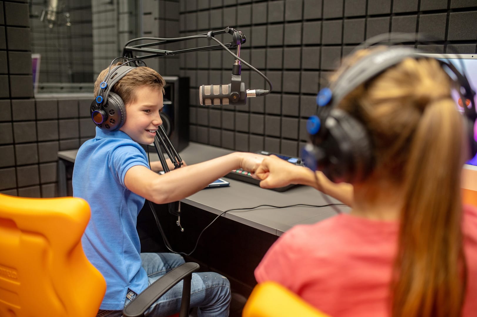 Two young students in podcast studio