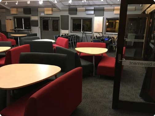 Relaxation and preparation space for students before performances or group sessions.