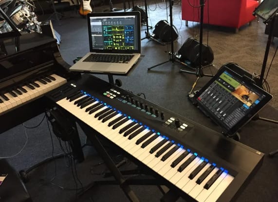 Performance stage with lighting, instruments, and audio system for student showcases.
